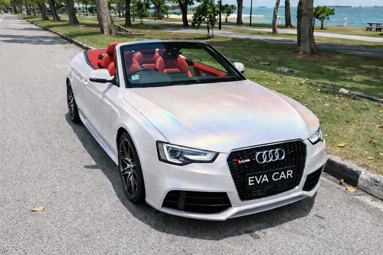 Audi A5 Cabriolet parked by the sea at East Coast Park, a relaxed birthday route in Singapore