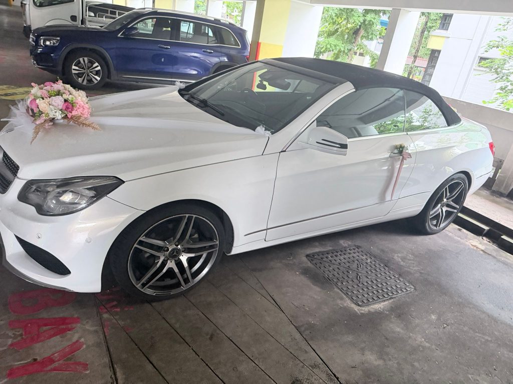 White Mercedes cabriolet dressed for a wedding, a mid-range convertible car rental Singapore cost
