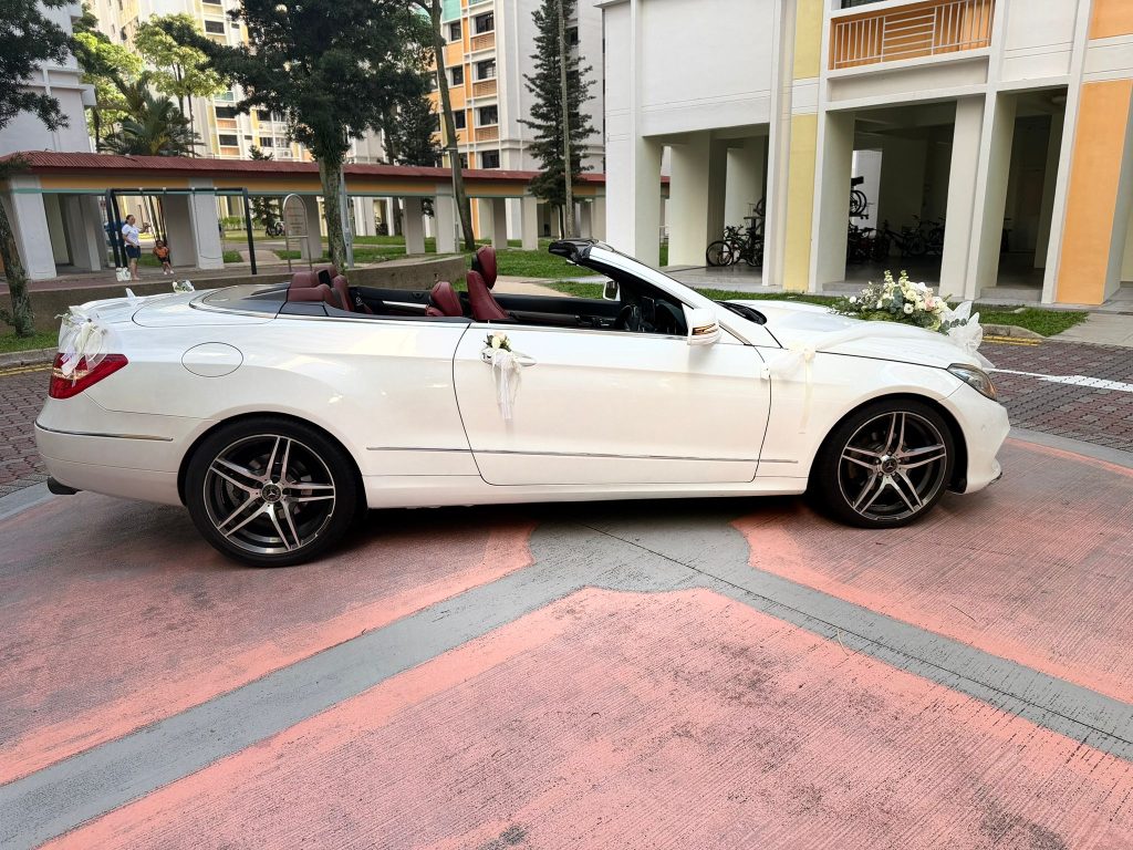 Side view convertible used for a wedding car rental Singapore checklist photoshoot route in Singapore.