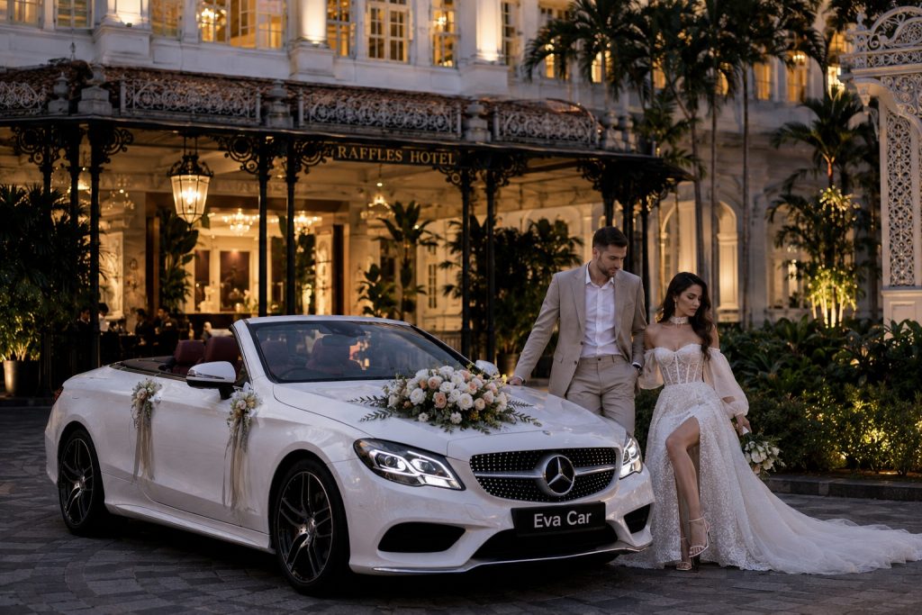 Wedding couple at Raffles Hotel planning a wedding car rental Singapore schedule for hotel pickup.