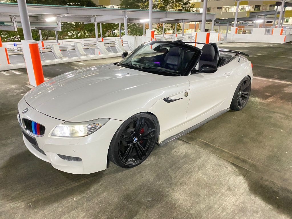 White BMW Z4 sDrive two-seater convertible ready for a birthday luxury car rental Singapore drive at night